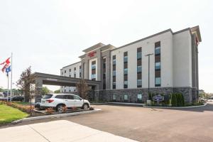 a car parked in front of a hotel at Hampton Inn Hamburg in Hamburg