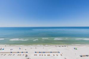 a view of a beach with chairs and the ocean at Hampton Inn & Suites Panama City Beach-Beachfront in Panama City Beach
