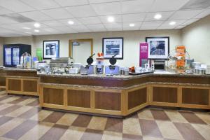 a lobby with a large counter with a buffet at Hampton Inn Toledo-South/Maumee in Maumee