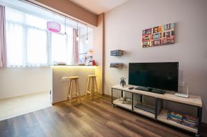 TV a/nebo společenská místnost v ubytování Newway Apartments