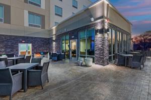 a restaurant with tables and chairs in front of a building at Hampton Inn & Suites Canyon, Tx in Canyon