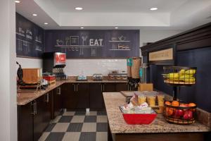 a kitchen with a counter with fruit on it at Hampton Inn Bartlesville in Bartlesville
