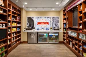 a pharmacy aisle with a treats counter in a store at Hampton Inn Columbia-Downtown Historic District in Columbia