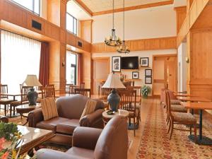 a living room with a couch and chairs at Hampton Inn & Suites Buffalo in Buffalo