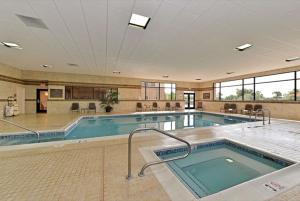 a swimming pool in a large building with a pool at Hampton Inn & Suites Buffalo in Buffalo
