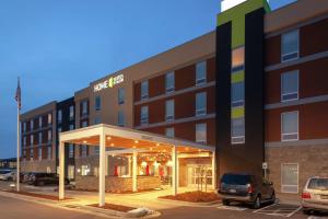 a hotel with a parking lot in front of a building at Home2 Suites By Hilton Denver South Centennial Airport in Centennial