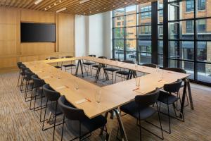 a large conference room with a long table and chairs at Canopy By Hilton Grand Rapids Downtown in Grand Rapids