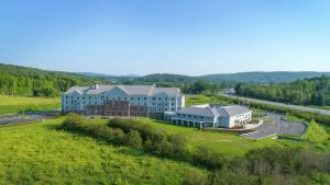 an aerial view of a large building in a field at Hilton Garden Inn Hanover Lebanon in Lebanon