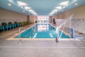 a large indoor swimming pool in a building at Home2 Suites By Hilton North Little Rock, Ar in North Little Rock