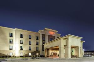 a hotel building with a sign on top of it at Hampton Inn Junction City in Junction City