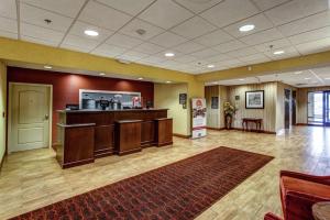 a large lobby with a waiting room with a counter at Hampton Inn Junction City in Junction City
