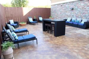 a patio with couches and a table and chairs at Hampton Inn & Suites Mount Pleasant in Mount Pleasant