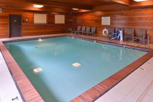 a large swimming pool in a hotel room at Hampton Inn Portland East in Portland