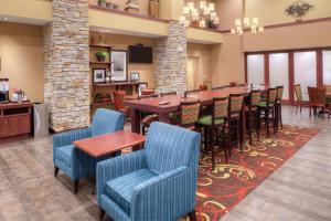 a dining room with a long table and chairs at Hampton Inn & Suites Rifle in Rifle