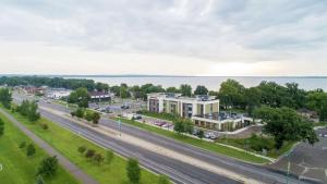 an aerial view of a city with a road and a building at Hampton Inn Spicer Green Lake, MN in Spicer