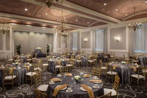 a banquet hall with tables and chairs in a room at DoubleTree Suites by Hilton Hotel Detroit Downtown - Fort Shelby in Detroit