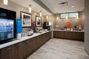 a waiting area of a pharmacy with a cash register at Hampton Inn Spicer Green Lake, MN in Spicer