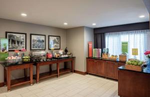 a hotel room with a counter with fruit on it at Hampton Inn Waldorf in Waldorf