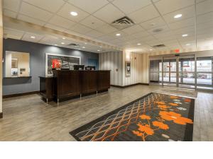 an office lobby with a reception desk and a rug at Hampton Inn & Suites by Hilton Lethbridge in Lethbridge