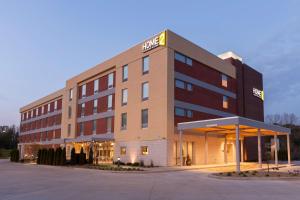 a hotel building with a sign on top of it at Home2 Suites by Hilton Canton in North Canton