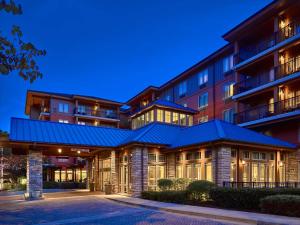 an exterior view of a building with a blue roof at Hilton Garden Inn Gatlinburg in Gatlinburg