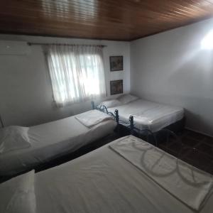 Lova arba lovos apgyvendinimo įstaigoje Casa Finca Tara en Cartagena