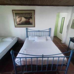 Lova arba lovos apgyvendinimo įstaigoje Casa Finca Tara en Cartagena