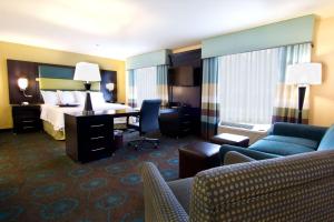 a hotel room with a bed and a desk at Hampton Inn & Suites Salt Lake City/Farmington in Farmington