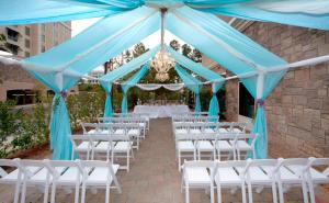 a marquee with white chairs and a blue tent at Hampton Inn & Suites Raleigh-Durham Airport-Brier Creek in Raleigh