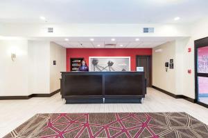 a woman standing in the lobby of a hotel at Hampton Inn and Suites Sandusky/Milan in Milan