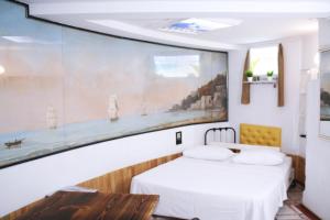 Postel nebo postele na pokoji v ubytování Mamba Hotel