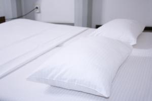 Postel nebo postele na pokoji v ubytování Mamba Hotel