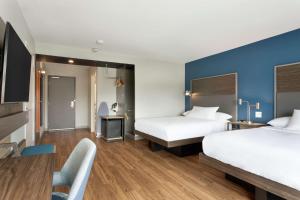 Tru By Hilton Frisco Dallas, Tx客房内的一张或多张床位