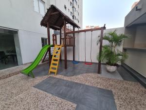a playground with a ladder and a swing at Moderno Monoambiente Amoblado en Equipetrol in Santa Cruz de la Sierra