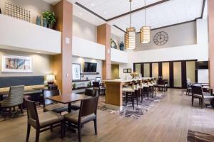 a large dining room with tables and chairs at Hampton Inn & Suites - Pittsburgh/Harmarville, PA in Harmarville