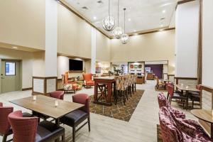 a lobby with tables and chairs and a living room at Hampton Inn By Hilton Bulverde Texas Hill Country in Bulverde