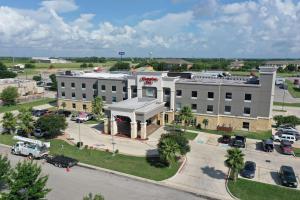 an aerial view of a large building with a parking lot at Hampton Inn Seguin in Seguin