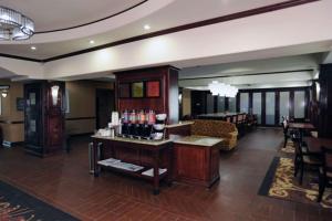 a lobby with a bar in a hotel room at Hampton Inn Seguin in Seguin