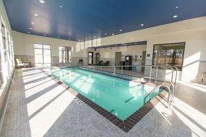 a large swimming pool in a large building at Hampton Inn & Suites Stroud in Stroud