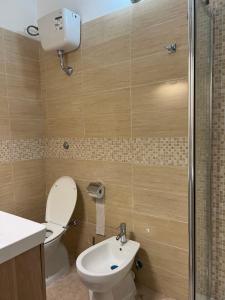 a bathroom with a toilet and a sink and a shower at Signorina In Rome in Rome