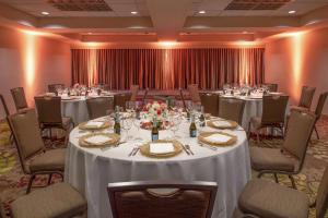 a banquet room with tables and chairs with white table cloth at DoubleTree Suites by Hilton Seattle Airport/Southcenter in Tukwila +24 photos