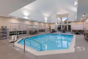 a large pool with blue water in a building at Hampton Inn & Suites Chicago-Hoffman Estates in Hoffman Estates