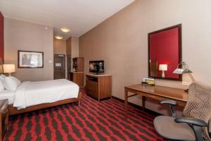 a hotel room with a bed and a desk at Hilton Garden Inn Closest Foxwoods in Preston