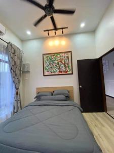 Katil atau katil-katil dalam bilik di Murni Inn Kampung Perigi
