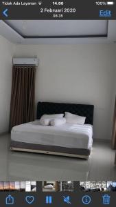 Säng eller sängar i ett rum på Villa American Style