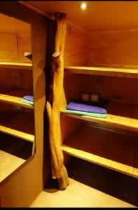 a sauna with wooden shelves in a cabin at Off the Grid Lakauta Lodge in San Pedro de Atacama