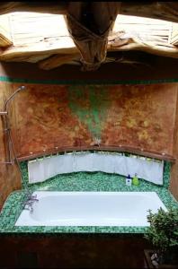 an overhead view of a bath tub in a room at Off the Grid Lakauta Lodge in San Pedro de Atacama