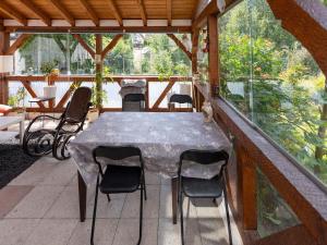 a table and chairs sitting on a porch with a table and chairs at Cosy apartment with sauna in the Black Forest in Sulz am Neckar