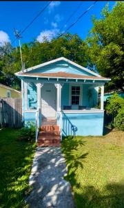 a small blue house with a porch at Key West Style Historic Home in Coconut Grove Florida, The Blue House in Miami