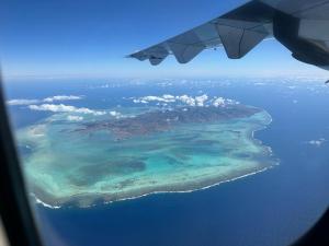 a view of an island in the ocean from an airplane at Palms Ocean views in Rodrigues Island